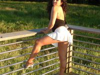 Latina MILF posing outdoors