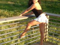 Latina MILF posing outdoors