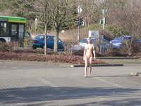 Posing naked in a public place