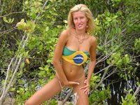 Blonde MILF posing at beach