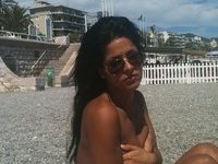 Brunette amateur girl sunbathing topless
