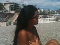 Brunette amateur girl sunbathing topless