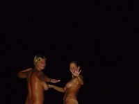 Three topless girls at picnic