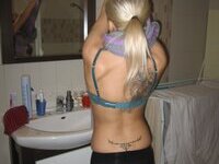 Tattooed amateur blonde babe love posing naked