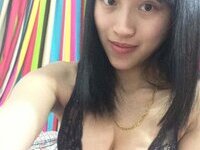 Asian girl showing her big tits
