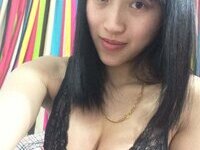 Asian girl showing her big tits