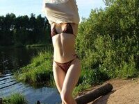 Sensual amateur girl with long hair posing naked at forest