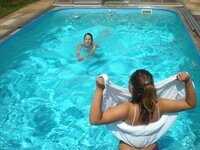 Three amateur girl near pool