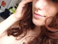 Redhead amateur babe making nude selfies