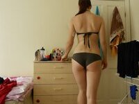 Amateur girl teasing in her room
