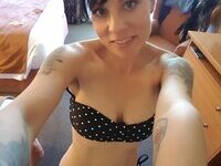 Tattooed amateur brunette MILF exposed herself