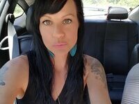 Tattooed amateur brunette MILF exposed herself