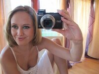 Sexy blonde amateur taking pictures of herself