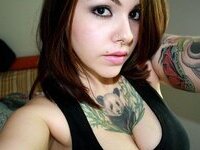 Sexy busty tattooed amateur babe
