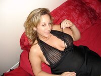 Sexy busty amateur MILF posing at home