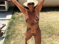 Sexy busty tattooed MILF