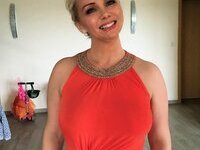 Sexy busty tattooed MILF