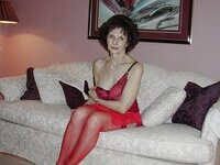 Mature amateur brunette posing on sofa