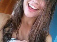 Smiley teen girl exposing herself