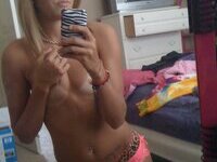 Slim and smiley blonde GF making nude selfies