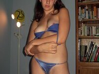 Young amateur girl posing at home