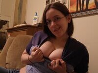 Busty amateur girl teasing at home