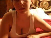 Busty amateur girl teasing at home