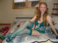 Curly amateur wife posing at bedroom