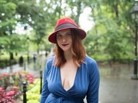 Curvy redhead with pierced nipples nude posing