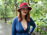 Curvy redhead with pierced nipples nude posing