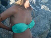 Busty blonde posing naked at beach