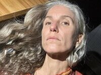 46 year old gray-haired woman