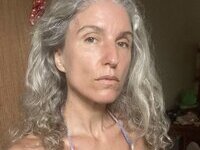 46 year old gray-haired woman