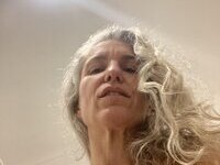 46 year old gray-haired woman