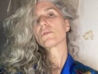 46 year old gray-haired woman