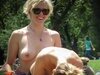 Topless tanning girls at city park