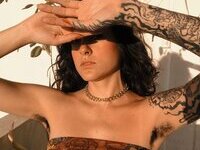 Less showing all her tattoos