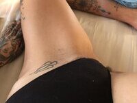 Less showing all her tattoos