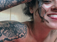 Less showing all her tattoos