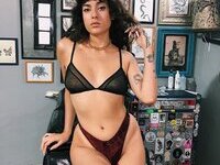 Less showing all her tattoos