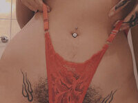 Less showing all her tattoos