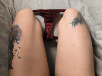 Less showing all her tattoos