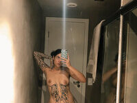 Less showing all her tattoos