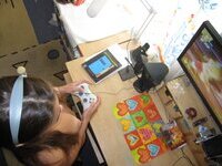 Cute brunette playing video games naked at home