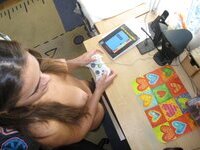 Cute brunette playing video games naked at home