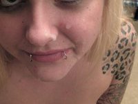 Tattooed blonde sucking deep