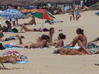 Topless babes on the beach