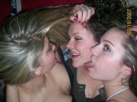Three kinky girls kissing