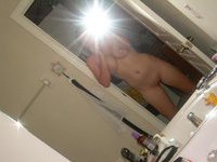 Naked in front of the mirror