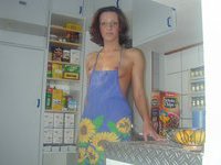 Horny housewife in the kitchen